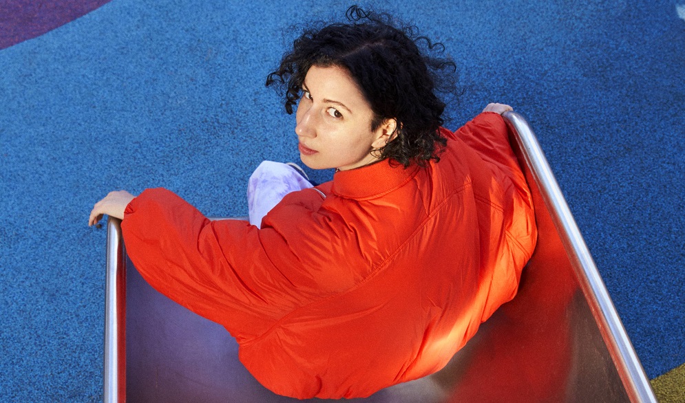 INTERVIEW: E^ST On Her 'Colourful' Debut Album, Being Inspired By Robyn, Joji & More