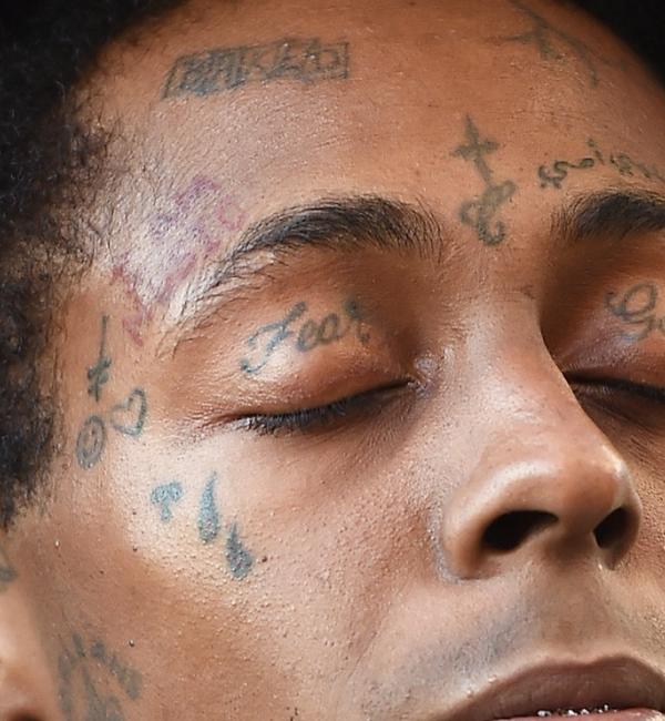 Lil Wayne  He  Image 9 from Tattoos of the Week Face Tattoos  BET